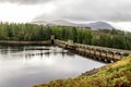 Laggan Dam holding lakeÃ¢â¬â¢s waters from entering River Spean, Scotland Royalty Free Stock Photo